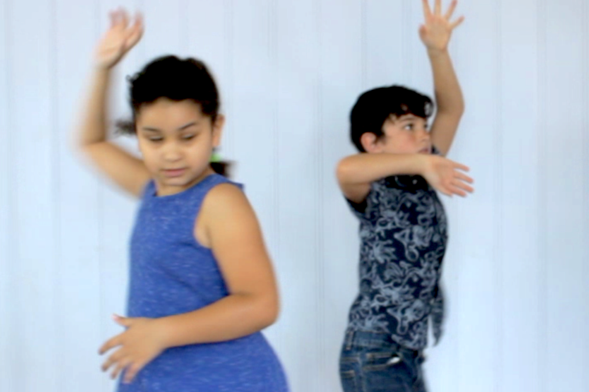 two young children dancing