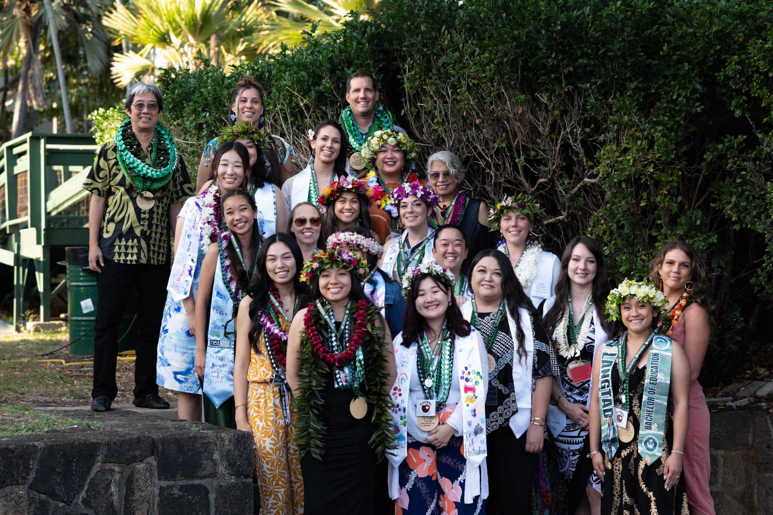 group photo wearing lei