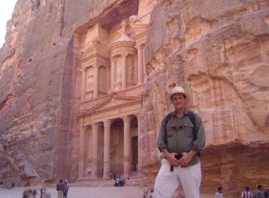 buddy in Jordan, fronting a building relief cut into a mountain