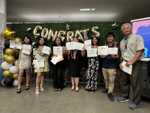 group of seven high school students with their advisor holding up their certificates and smiling