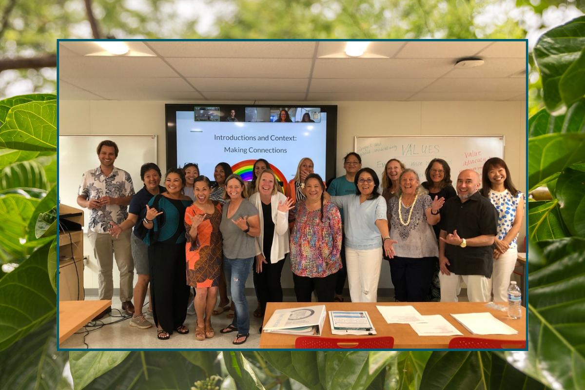 group photo of CT academy participants with online participants on the screen behind