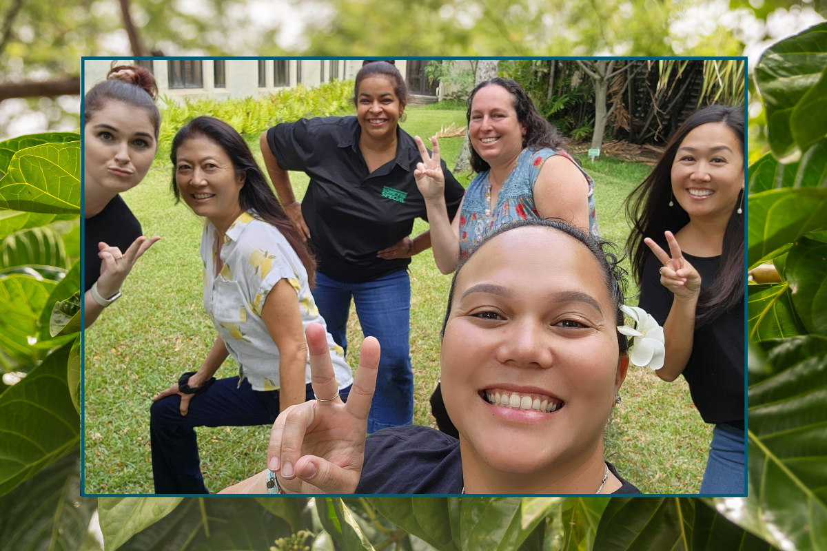 group photo of participants smiling and holding up peace and shaka signs