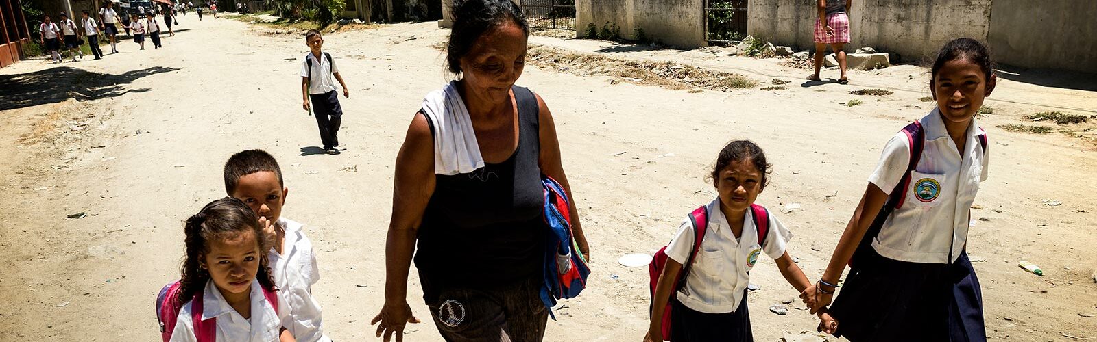 Woman and children walking