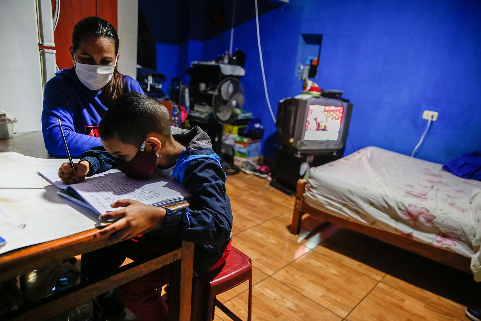 boy learning at home during covid