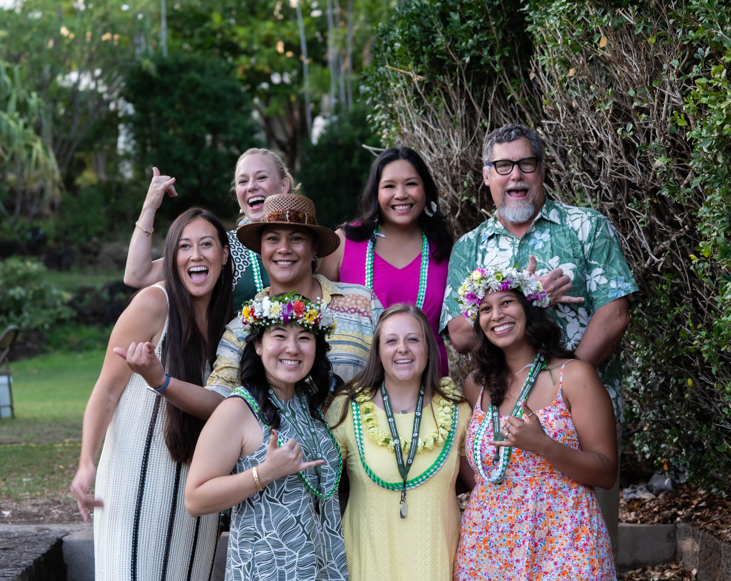 group photo of MEd in special education graduates with faculty wearing leis at the 2024 college of education convocation