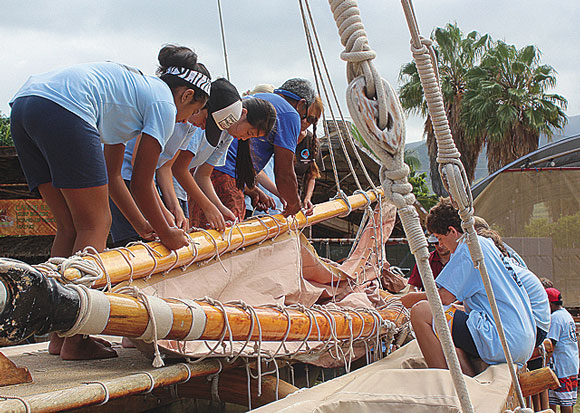 Students working on canoe
